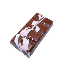 Chocolate bar with pink and white designs on a white background
