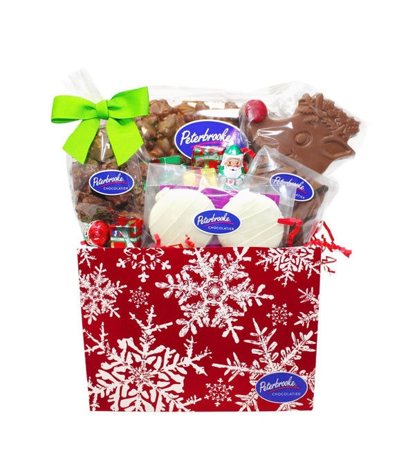 Christmas-themed gift basket with Peterboro chocolates on a white background