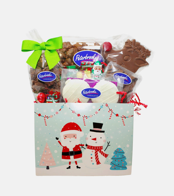 Christmas-themed gift basket with Peterbrooke chocolate products on a white background